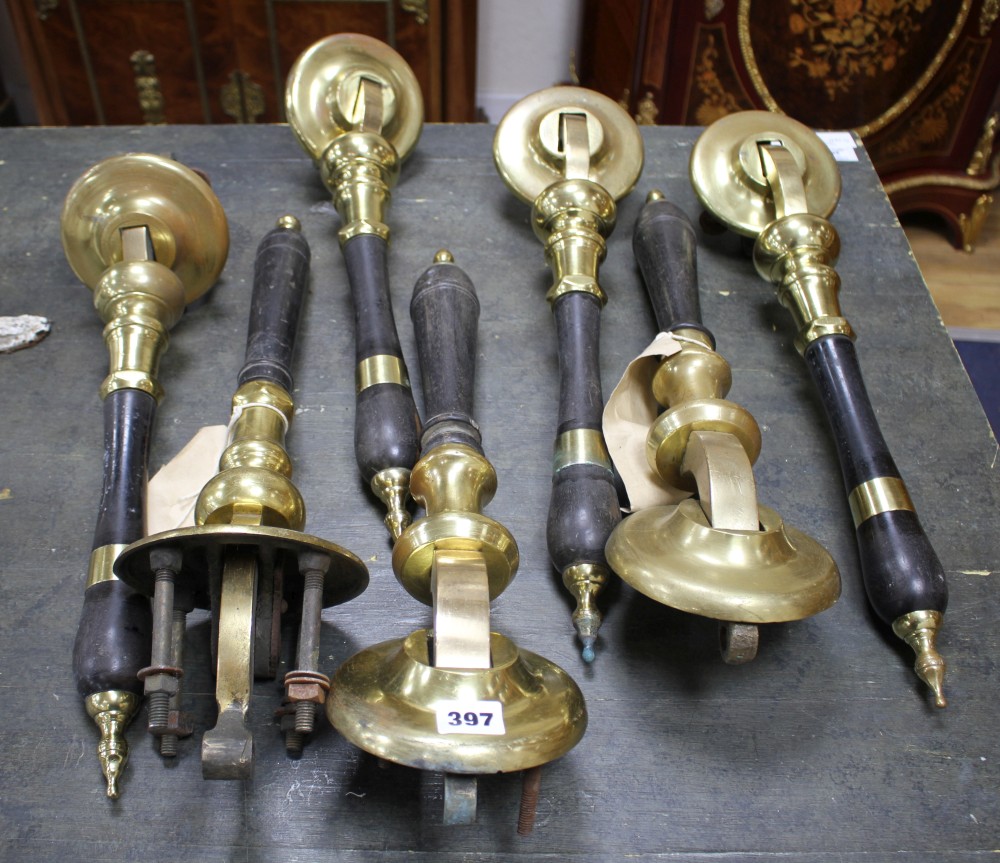 A set of four brass mounted ebony beer pumps, 46cm, another pair and one other beer pump